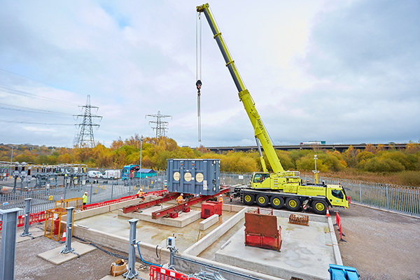 Yellow heavy lift crane in operation